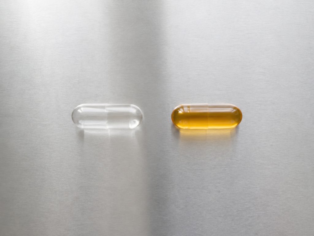 Comparison of standard and liposomal supplement capsules illustrating improved nutrient bioavailability and advanced delivery technology.