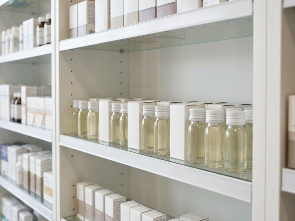 Vitamin shot bottles and supplement packaging displayed on pharmacy shelves – Noviatic.